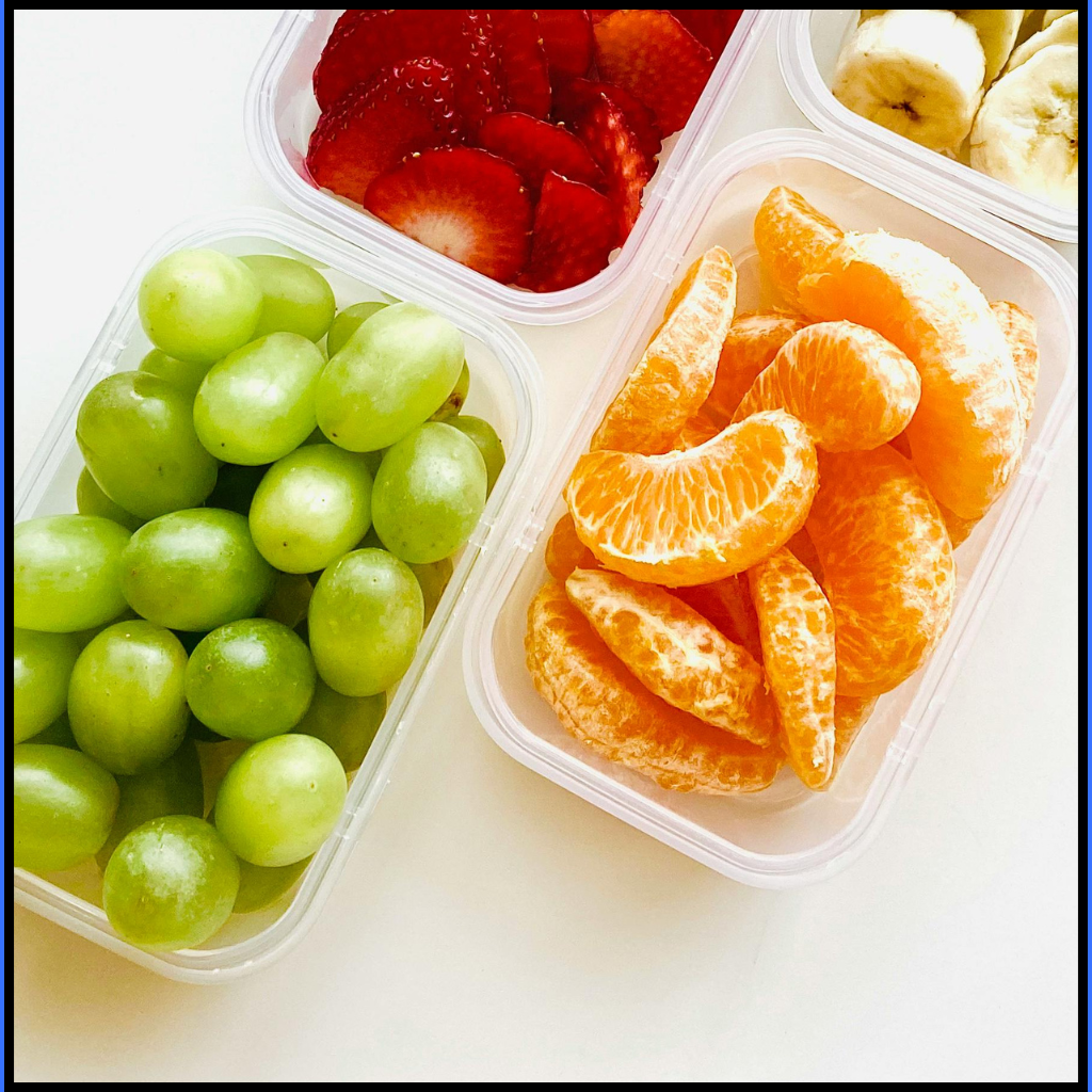 Snack Time and Speech Therapy: 5 Ways to Turn Crackers Into Language 2 Containers of grapes, orange slices, strawberries, and bananas for snack time and speech therapy in a preschool classroom.